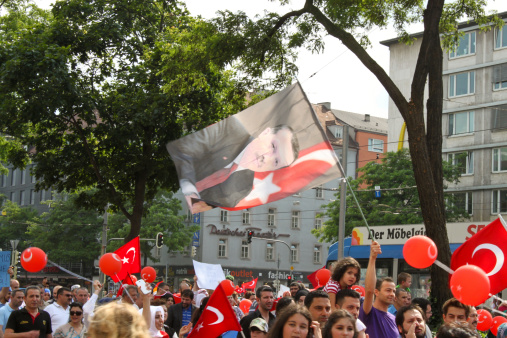 Munich, Germany - July 6, 2013:  People of turkish origin came to a demonstration to support Prime Minister of Turkey Recep Tayyip Erdogan in Munich on July 6, 2013.