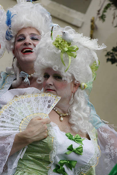 Belles in drag New Orleans, LA, USA aa March 08, 2011: Men in drag are costumed for Mardi Gras as ladies of the court of Marie Antoinette and parade through the streets of the French Quarter. mardi gras body painting stock pictures, royalty-free photos & images