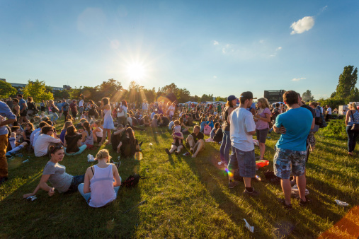 Berlin, Germany - June 21, 2013: Groups of people socialising and listening to the music at the Feta De La Musique events in Mauerpark, Prenzlauer Berg, Berlin, Germany.