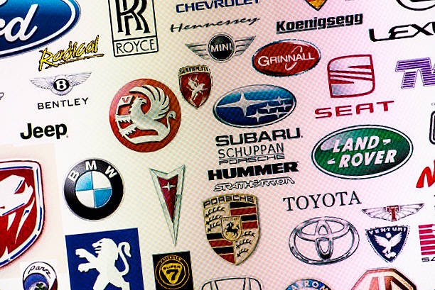 A closeup view of the word classic written as a chrome emblem in a retro font set on a car painted in reflective red paint - 3D render