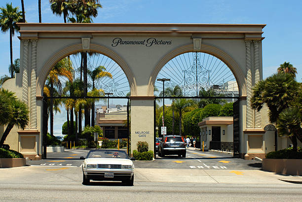 Paramount Pictures Los Angeles, United States - July 01, 2009Middleaged man driving his Cadillac out of the Melrose Avenue entrance to Paramount Pictures. paramount studios stock pictures, royalty-free photos & images