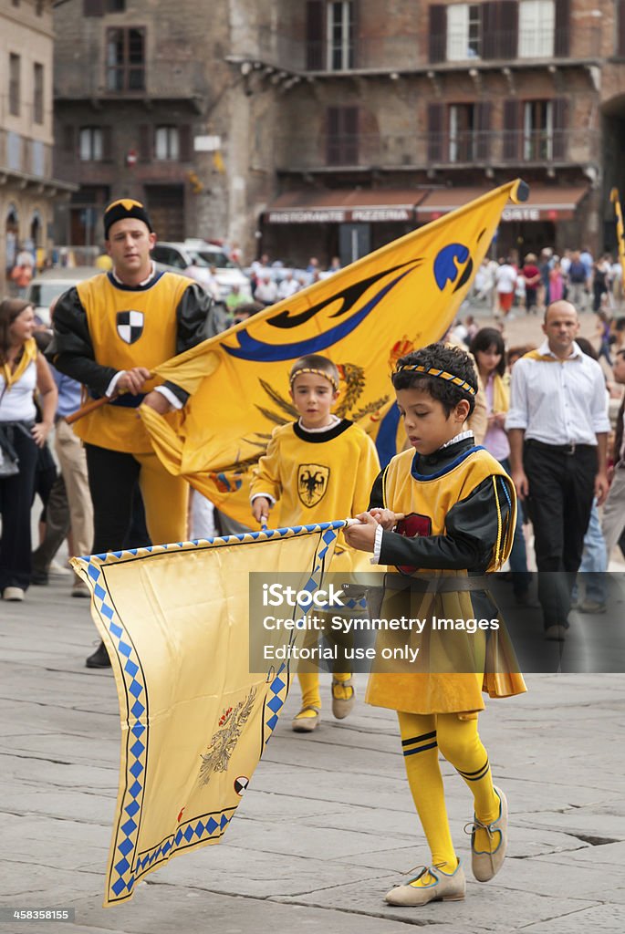Palio Parade Siena, Italy - September 16, 2007: Young man in celebration dress parades his winning contrade. Arezzo Stock Photo