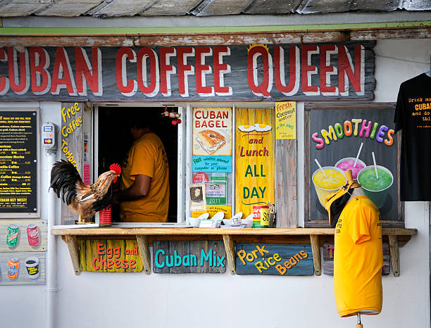 Key West Cuban Coffee Purveyor Key West, Florida, USA - December 5, 2012: Key West Cuban Coffee purveyor in shack: Cuban Coffee Queen. There is a person in the scene but they are incidential. The true subject of the photo is the structure and signage. mike cherim stock pictures, royalty-free photos & images