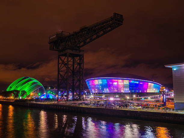 SSE Hydro and SECC Armadillo at night. Glasgow, Scotland - October 4, 2013: The newly opened SSE Hydro, Glasgow's new 12000 seat entertainment venue.  The SSEA Hydro will attract an audience of one million visitors each year, which positions it as the fifth busiest entertainment arena in the world, alongside iconic venues like Madison Square Garden and The O2 arena.  London-based Foster + Partners are the architects behind The SSE Hydro. clyde river stock pictures, royalty-free photos & images