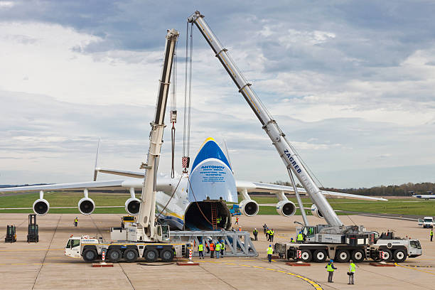 Antonov AN-225 Mriya embarking load Zagreb, Croatia - November 9, 2013: Biggest plane in the world, Ukrainian Antonov AN-225 Mriya, is embarking 140 ton power generator on Zagreb airport to ship it to power-plant in the Philippines. pleso stock pictures, royalty-free photos & images