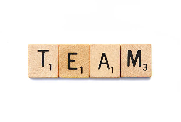 West Palm Beach, USA - November 1, 2013: Scrabble game letter blocks spelling out the word TEAM. Scrabble is a crossword strategy board game distributed by Hasbro.