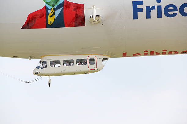 Friedrichshafen, Germany - July 9, 2013: Airship in Friedrichshafen. The Zeppelin hovers in the air. He starts to scenic flights over Lake Constance and the Alps. The passengers enjoy the fantastic view. The Zeppelin was built in the city of Friedrichshafen/Lake Constance.