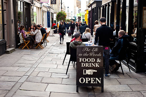People enjoy outdoor dining in London stock photo