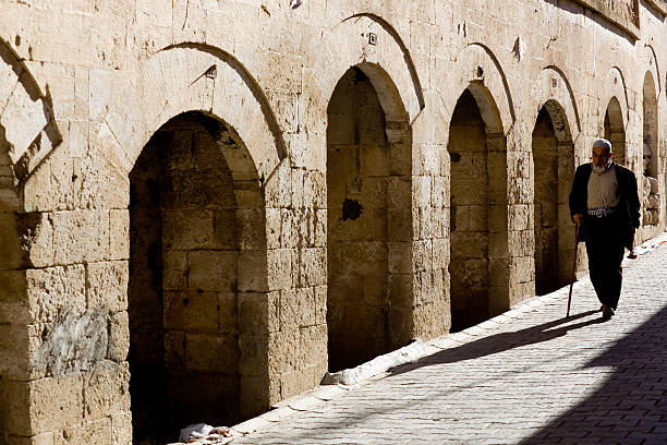 Midyat, Turkey - November 2, 2010: Old market place in Midyat.The market is said to be abadoned by christian assyrians who has migrated to western countries for Gastarbeiter  (guest worker) in 1950s.Christians who prefered not to migrate and Muslims still live together peacefully.
