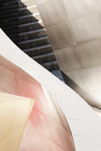 Los Angeles, California, USA - August 24, 2013: Hidden architectural stairwell abstract along an exterior wall of The Walt Disney Concert Hall, Los Angeles, California. The Frank Gehry designed building opened on October 23, 2003, and is home to the Los Angeles Philharmonic Orchestra and the Los Angeles Master Chorale. Disney's wife fermented the idea for the building in 1987. Gehry's concept evolves around a sailboat hull with open canvas. The exterior is constructed of more than 12,000 steel panels, no two of which are exactly alike. The public has access to the entire exterior perimeter using walkways and hidden stairwells like this.