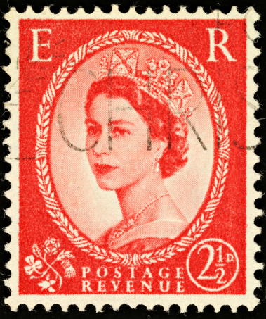 Exeter, United Kingdom - February 1, 2010: British Two and a Half Pence Red Used Postage Stamp showing Portrait of Queen Elizabeth 2nd, printed and issued between 1952 to 1965