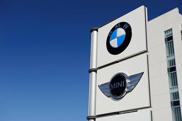 BMW and MINI Signage Richmond Hill, Ontario, Canada - March 27, 2011: BMW and MINI signage outside the BMW Group Canada headquarters in Richmond Hill. bmw dealership stock pictures, royalty-free photos & images