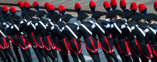 Turin, Italy - June 25, 2011: A soldiers in full uniform after salute the flag back to the barracks during the national meeting of militar police for 150th anniversary of the Italian republic celebrated in Turin.