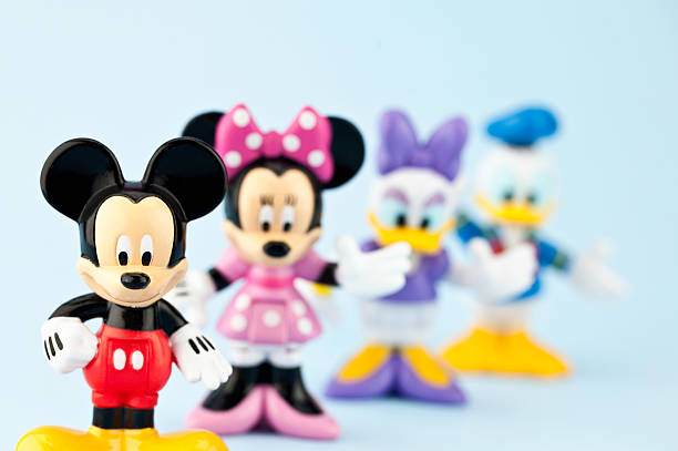 Mickey Mouse and Friends Suffolk, Virginia, USA - April 30, 2011: A horizontal studio shot of the Disney cartoon characters Mickey Mouse, Minnie Mouse, Daisy Duck and Donald Duck. Here Mickey Mouse is standing in the foreground and is the focal point of the image, while the other characters are defocused in the background. small group of animals stock pictures, royalty-free photos & images