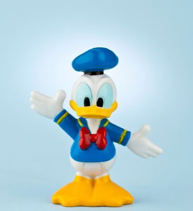 Suffolk, Virginia, USA - April 30, 2011: A square format studio shot of the Disney cartoon character Donald Duck. Here Donald is dressed in a sailor outfit and is standing facing the camera with his arms outstretched.
