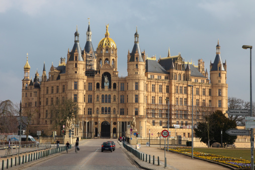 Schwerin, Germany - April 12, 2013: Unidentified people in front of Schwerin Castle, the seat of the state parliament of Mecklenburg- Vorpommern in Schwerin, Germany.