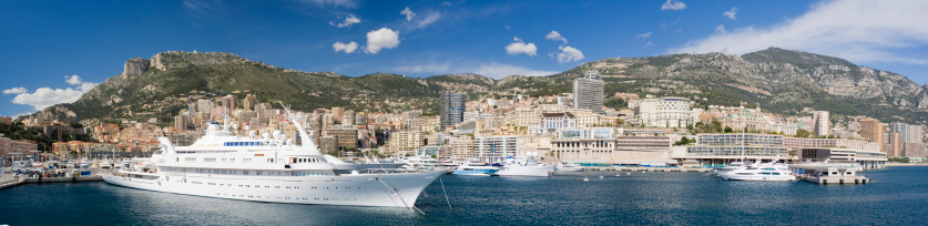 Monte Carlo, Monaco - March, 27th 2010: Large yachts in the harbour of Monte Carlo. View looking north towards the city.