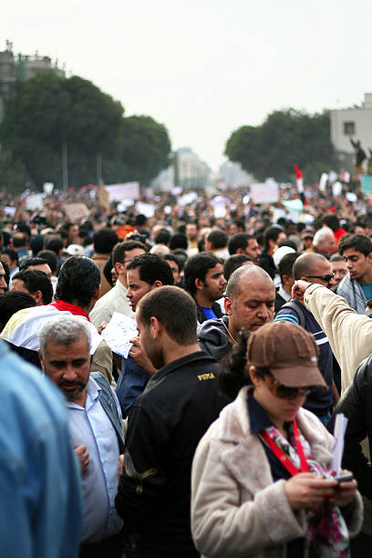 Large group of people using their mobile phones stock photo