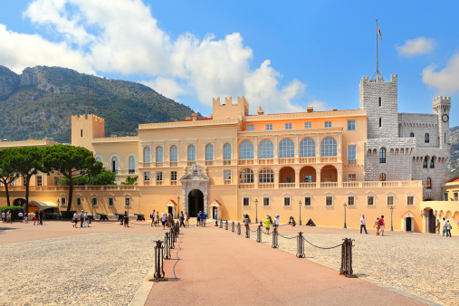 Monaco-Ville, Monaco - July 26, 2013: Tourists in front of Exterior Royal Palace - official residence of Prince of Monaco. It is one of the major tourist attraction and remains fully working palace  in Monaco on July 27, 2013.