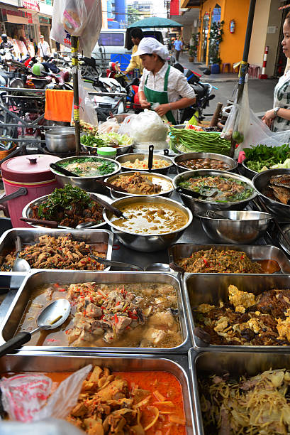 Bangkok, Thailand - October 24, 2013; There are so many small restaurants everywhere in Bangkok. Delicious Thai foods on the sidewalk restaurant in Chinatown, Bangkok