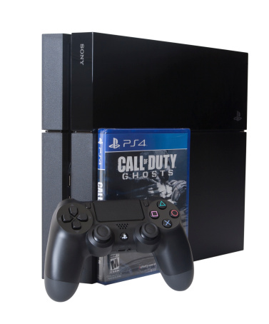 Las Vegas, USA - November 15, 2013: A photo of the PlayStation 4 video game system isolated on a white background photographed with the Call of Duty Ghosts video game. The PlayStation 4 or PS4 is a video game console from Sony Computer Entertainment and was launched on November 15, 2013 in North America.