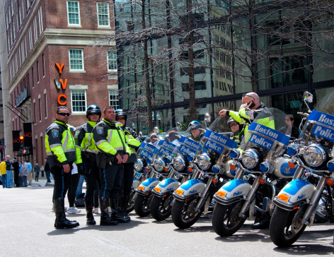 Boston, United States - April 15, 2013: Police man with motorbikes before the bombing at the Boston Marathon.