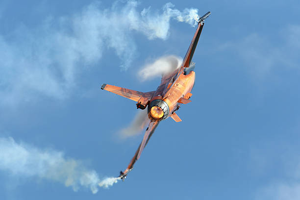 Fairford, Gloucestershire, United Kingdom - July 20th, 2013: Royal Netherlands Air Force F-16 displaying with afterburner and smoke winders at the Royal International Air Tattoo (RIAT)