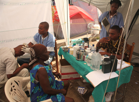 Cap-Haitien, Haiti - February 4th, 2010 : A team of Haitian volunteer doctors operate out of a tent to treat injuries caused by the earthquake. The earthquake caused tremendous damage to human lives and infrastructure.