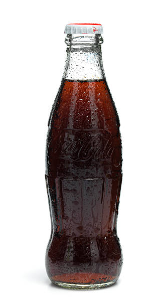 Classic Cola bottle Gothenburg, Sweden - June, 04 2011: Classic Coca Cola bottles photographed in a photo studio. soda bottle stock pictures, royalty-free photos & images
