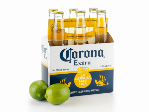 Calgary, Canada - April 5, 2011: Six Pack of Corona Beer Bottles with Limes shot in Studio on white with Natural Drop Shadow, Corona is an Imported Beer from Mexico