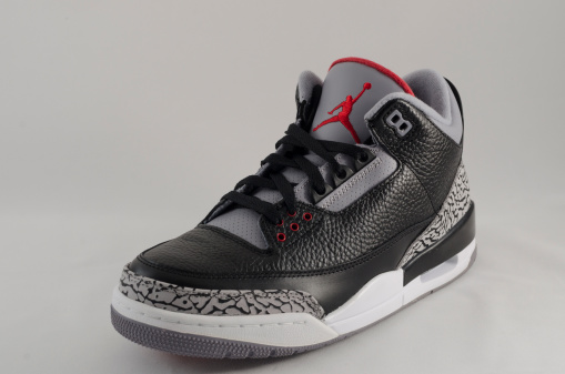 Bergen County New Jersey, USA - September 8, 2013: A Nike Air Jordan III in a black and grey colorway. The Air Jordan 3 was a pivitol release in the Air Jordan sneaker legacy. Said to be Michael Jordan's favorite shoe, this design was the first to feature the 