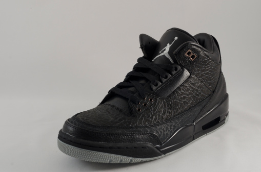 Bergen County New Jersey, USA - September 8, 2013: A Nike Air Jordan III in an all black colorway. The Air Jordan 3 was a pivitol release in the Air Jordan sneaker legacy. Said to be Michael Jordan's favorite shoe, this design was the first to feature the 
