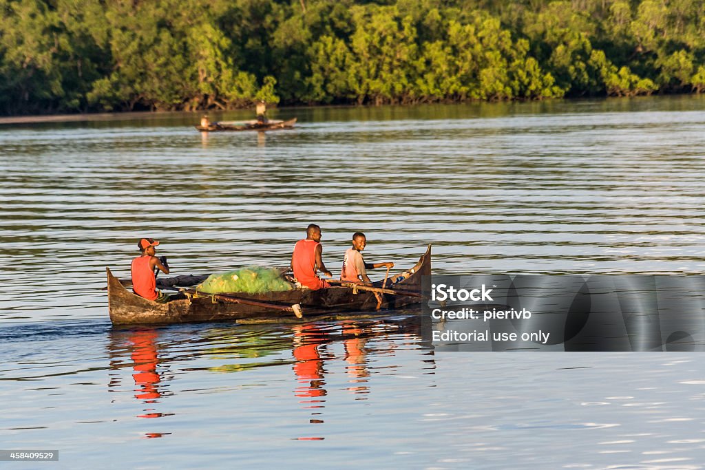 Fishermen going fishing Nosy Be, Madagascar - April 4, 2008: Malagasy people going fishing in an outrigger canoe Adult Stock Photo