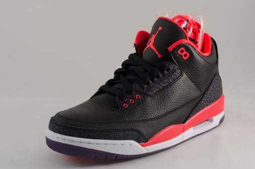 Bergen County New Jersey, USA - September 8, 2013: A Nike Air Jordan III in a black and red colorway. The Air Jordan 3 was a pivitol release in the Air Jordan sneaker legacy. Said to be Michael Jordan's favorite shoe, this design was the first to feature the 