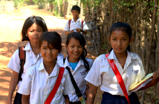 Siem Reap, A!ambodia - November 16, 2010: A group of unidentified school girls returning from school in a small village near Siem Reap on November 16, 2010, Cambodia. Education began making a slow comeback.