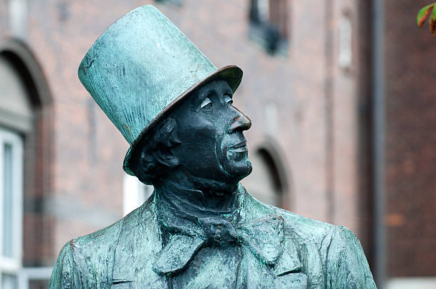 Statue of the famous Danish author Hans Christian Andersen Copenhagen, Denmark - June 30th, 2011: On the city hall square in Copenhagen stands this statue of Hans Christian Andersen whom is a famous Danish author. The statue is made by Henry Luckow-Nielsen in 1965. hans christian andersen stock pictures, royalty-free photos & images