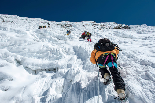 Island Peak,Nepal-April 07,2012:The Climbers climbing the ice wall to the top of Island Peak (Imja Tse) summit(6189m) in the Himayalas Everest region,Nepal.