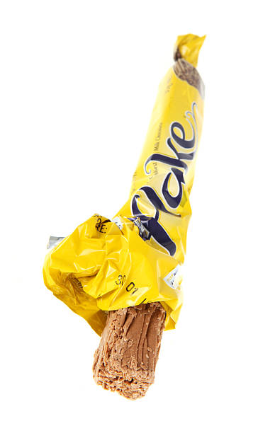 Unwrapped Flake Brisbane, Australia - 1 April, 2011: A Flake bar with one end unwrapped, on white. cadbury plc photos stock pictures, royalty-free photos & images