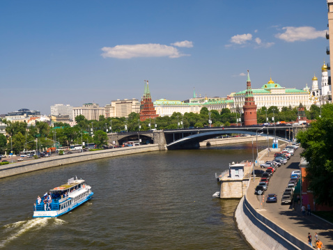 Moscow, Russia - June 25, 2010:Tourist Cruise Line ship on river Moscow with Kremlin in the background.