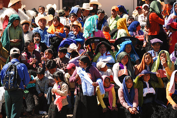 San Juan Chamula, San Cristobal, Chiapas, Mexico - February 20, 2007: Indigenous Tzotzil Maya stands waiting for the village festival.