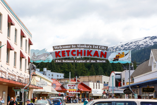 Ketchikan, Alaska, USA-July 5, 2013: Welcome sign  located in downtown Ketchikan's main street greets town visitors. Photograph was taken in the morning of July 5, 2013. The sign celebrates the fishing heritage of the town of Ketchikan.