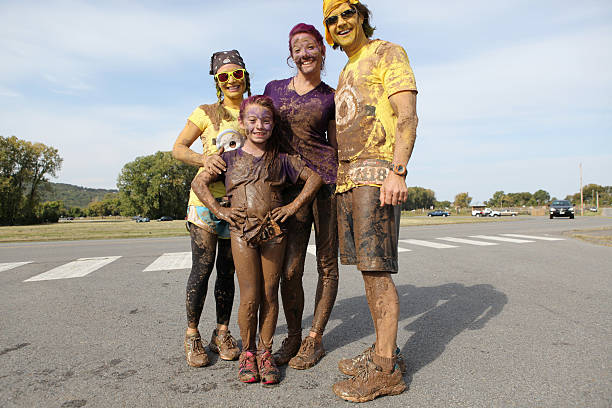 Group of runners excited after Mud Run stock photo