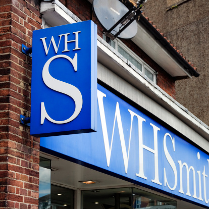 Beckenham, England - May 8, 2011: A sign and fascia on a branch of the WHSmith newsagents and stationers retail chain of shops in Beckenham, Kent (South East London) with sign and fascia. WHSmith was founded in 1792 by Henry Walton Smith in a small news vendor's shop in London. Their son William Henry Smith eventually inherited the business and turned it into the main newspaper distributor in the country, with bookstalls on numerous railway stations. WHSmith has been a British household name for decades.