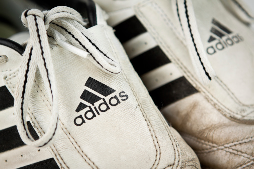 Shetland Isles, North of Scotland, UK - June 6th, 2011:  Close-up shot of a pair of heavily worn Adidas trainers.