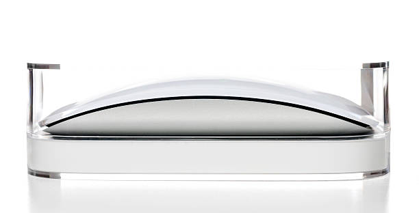 Apple Magic Mousein plastic box Miami, USA - October 28, 2013: Apple Magic Mousein plastic box. Apple brand is owned by Apple, Inc. magic mouse stock pictures, royalty-free photos & images