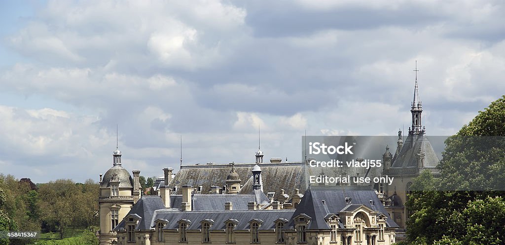 Chateau de Chantilly, France Chantilly, France- May 12, 2012: Chateau de Chantilly ( Chantilly Castle ), located in the town of Chantilly, France. The Chateau consists of two buildings: Petit Chateau (built in 1560) and Grand Chateau (was destroyed during the French Revolution and rebuilt in 1870). The Chateau is Musee Conde - one of the best art galleries in France Chateau de Chantilly Stock Photo