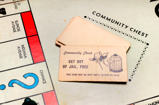 Phoenix, United States - June 18, 2011:  In the Monopoly board game by Hasbro, players sometimes choose a card from the Community Chest.  One possibility is the \