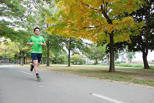 Young man jogging stock photo