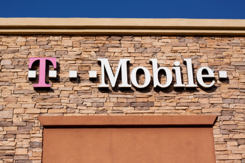 Chula Vista, California, USA - April 29, 2011: T Mobile Sign on a stone building facade. T-Mobile USA provides cell phone and data services across the nation. T-Mobile is one of the top three global  wireless carriers and T-Mobile USA is a subsidiary of Deutsche Telekom AG.