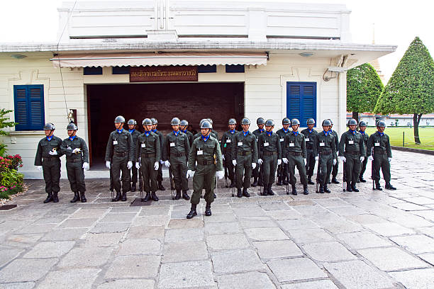 Bangkok, Thailand - January 4, 2010:  Parade of the kings Guards, in the Grand Palace, Guards are controlling the entrance of the main gate of the Grand Palace in Bangkok, Thailand